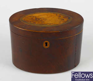 A George III inlaid mahogany oval tea caddy