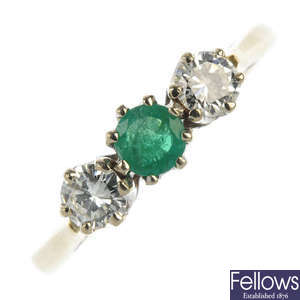 An 18ct gold emerald and diamond three-stone ring