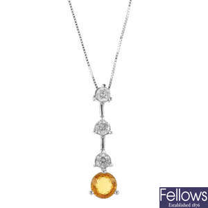 A sapphire and diamond pendant with platinum chain.