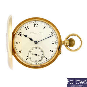 An open face pocket watch by Charles E Rose. 