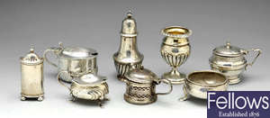 A selection of eight George II and later silver condiments.