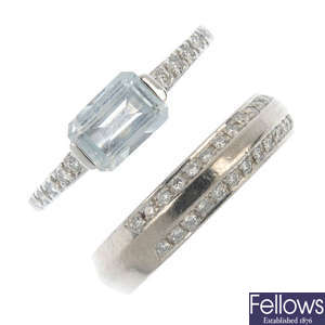 An aquamarine and diamond ring and diamond band ring.