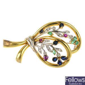 An 18ct gold diamond and gem-set brooch.