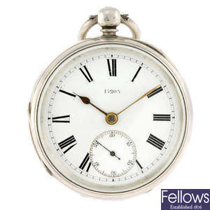 A silver open face pocket watch together with a silver Albert chain and a silver shield fob.  