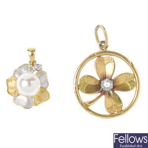 Two gem-set foliate pendants.