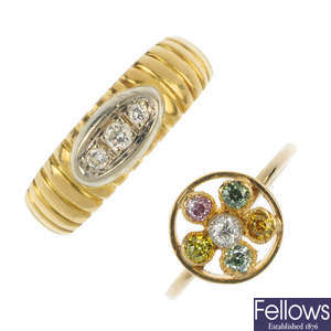 A colour treated diamond dress ring and a diamond three-stone ring.