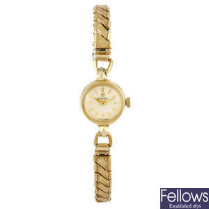 OMEGA - a lady's gold plated bracelet watch. 