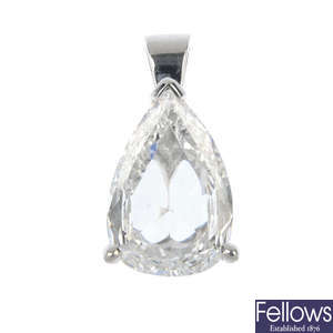 An 18ct gold diamond single-stone pendant. 