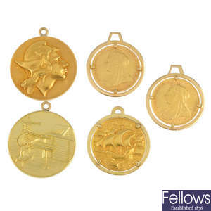 A selection of five coins and medallions.