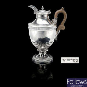 A George III silver hot water pot by Paul Storr.