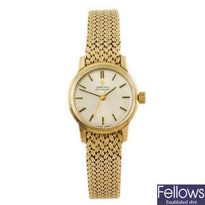OMEGA - a 9ct gold lady's bracelet watch.