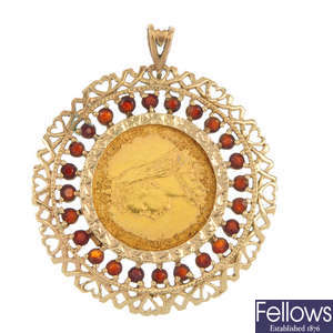 A 9ct gold mounted and gem-set 1889M sovereign pendant. 
