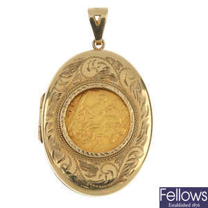A 9ct gold locket with half-sovereign inset.
