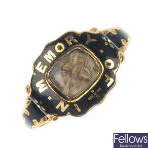 An early Victorian 18ct gold enamel and hair memorial ring.