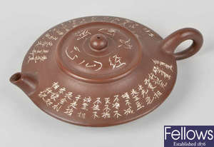 A Chinese Yixing red stoneware tea or wine pot