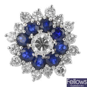 A diamond and sapphire floral cluster ring.