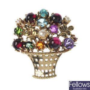 A gem-set floral brooch.