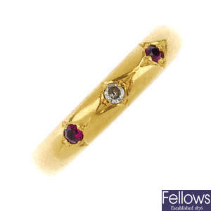 A 1920s 22ct gold diamond and synthetic ruby three-stone ring.