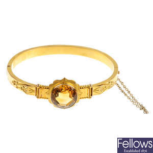 A late 19th century 18ct gold citrine hinged bangle.
