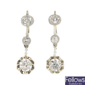 A pair of diamond three-stone ear pendants. 
