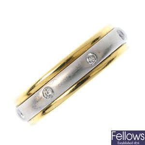 A diamond bi-colour swivel band ring.