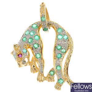 A diamond and emerald leopard pendant.