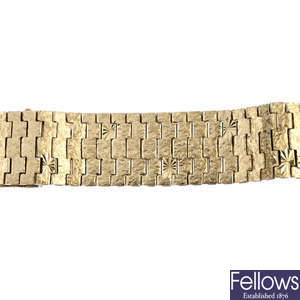 A mid 20th century 9ct gold panel bracelet. 