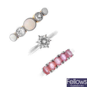 A selection of three gem-set and diamond rings.