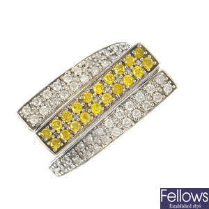 A 14ct gold diamond and colour treated 'yellow' diamond dress ring.