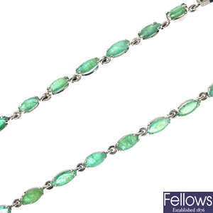 An emerald line necklace.