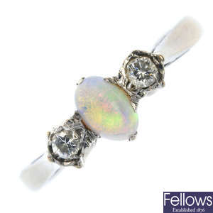 A mid 20th century 18ct gold opal and diamond three-stone ring.