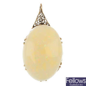 An opal single-stone pendant.