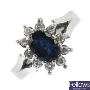 A platinum sapphire and diamond cluster ring.