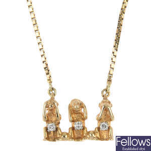 A diamond 'three wise monkeys' pendant.