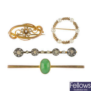 A selection of four brooches.