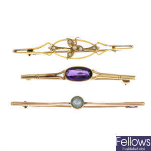 A selection of five brooches.