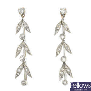 A pair of diamond ear pendants.