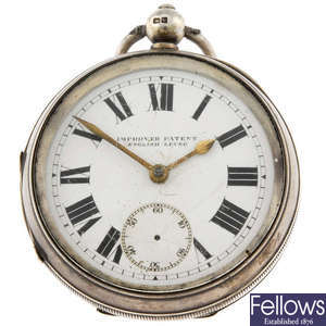 A silver open face pocket watch with another two pocket watches.