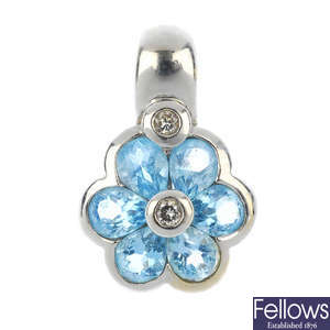 An 18ct gold diamond and topaz floral pendant.