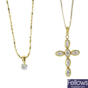 An 18ct gold diamond single-stone pendant and a sapphire cross pendant. 