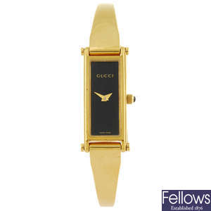 GUCCI - a lady's 1500L bracelet watch with a lady's Raymond Weil bracelet watch.