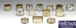 A selection of fourteen silver napkin rings & another example.