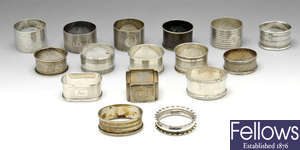 A selection of sixteen silver napkin rings.