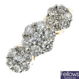 A 14ct gold diamond triple cluster ring. 