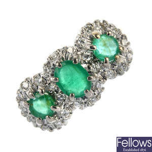 An 18ct gold emerald and diamond triple cluster ring.