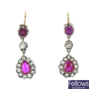 A pair of ruby and diamond ear pendants.