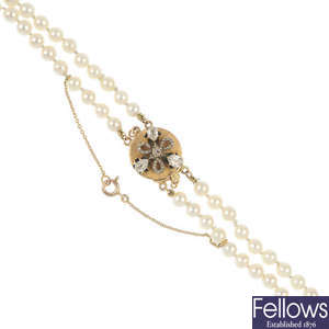 A cultured pearl two-row necklace, with diamond clasp. 