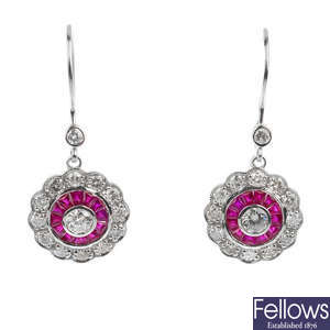 A pair of ruby and diamond cluster ear pendants.