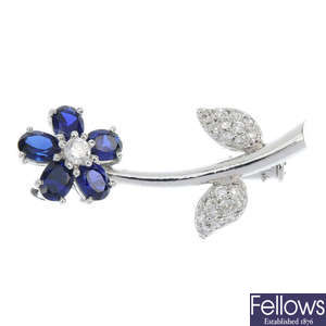 A sapphire and diamond floral brooch.