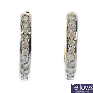 A pair of 9ct gold diamond ear hoops.